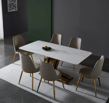 Modern White Marble Dining Table with Golden V-Shaped Base & Beige Chairs