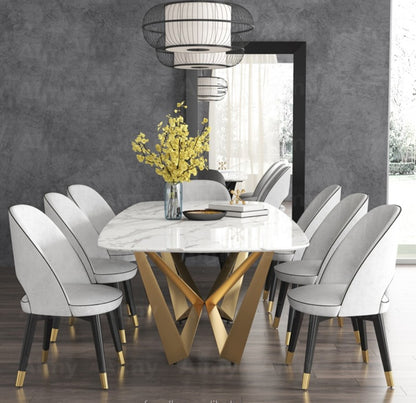 Modern White Marble Dining Table with Golden Geometric Base & Black Chairs –